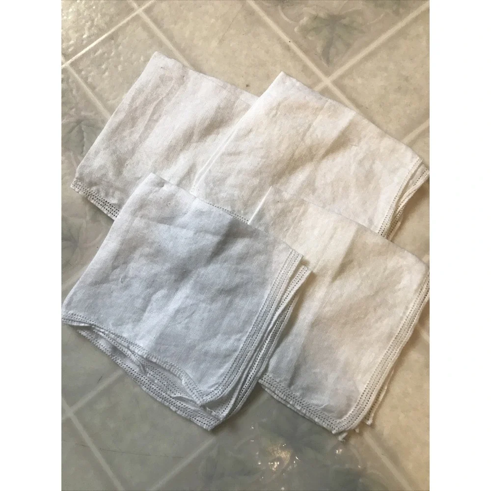 Set of Four White Linen Like Punched Pattern Napkins Delicate Edging
